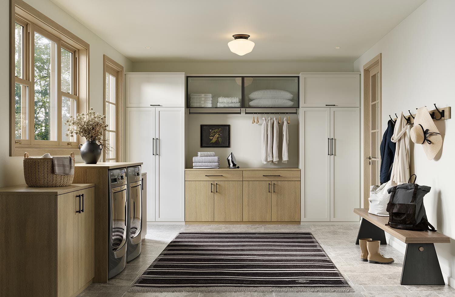 Custom entryway room with laundry storage in a light white wood finish by California Closets