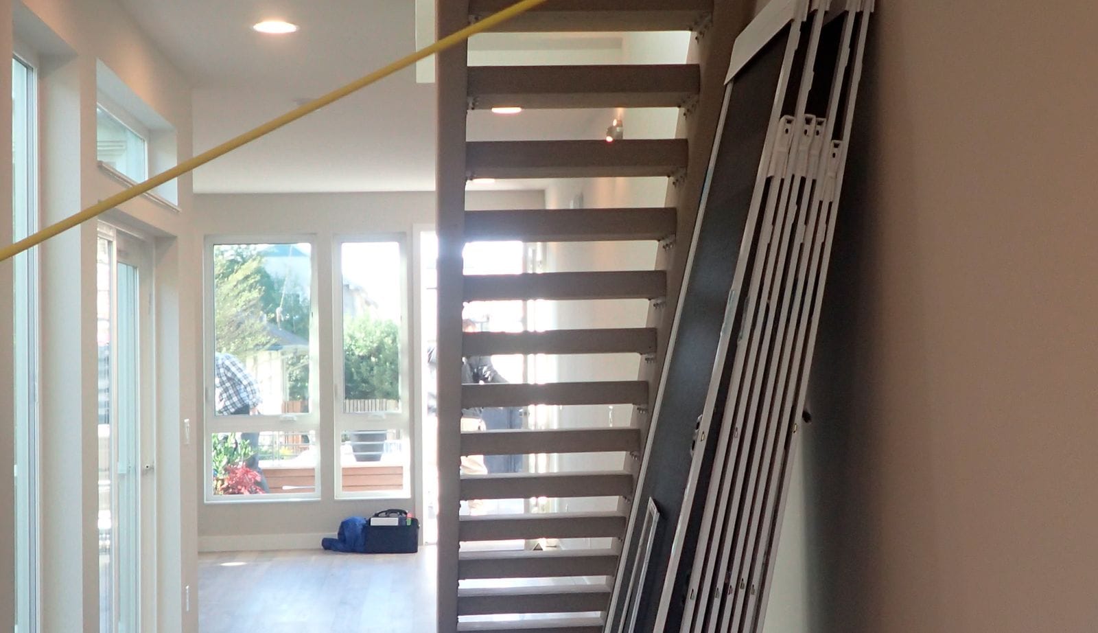 Before a custom pantry will be built under empty stairwell space by California Closets